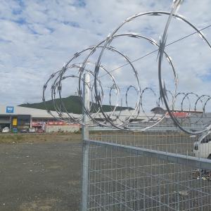 50x200mm  welded fence install with 3 line barbed wire and fence razor wire on top 50x200mm  welded fence install with 3 line barbed wire and fence razor wire on top